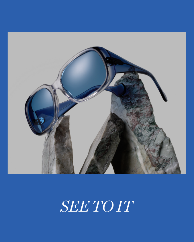 blue sunglasses from Morgenthal Frederics displayed on rocks