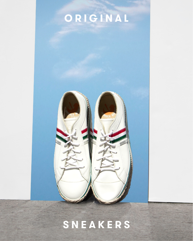 Spingle shoes on top of mirror showing sky