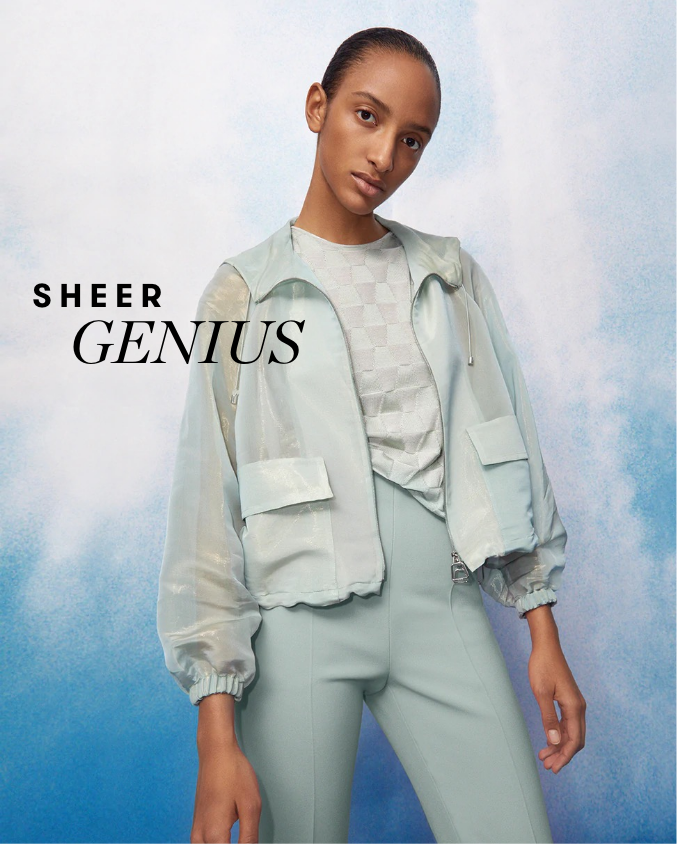Woman wearing seafoam green colored outfit from AKRIS